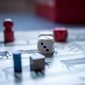 Dices and Wooden Pieces on Game Board